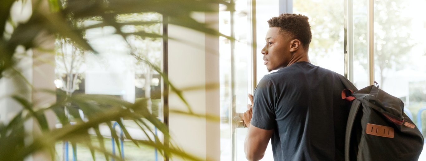 student looking out window